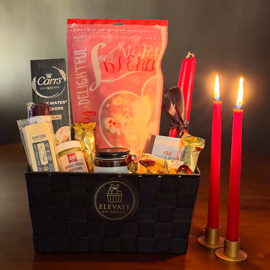 Gift basket with candles on a wooden surface